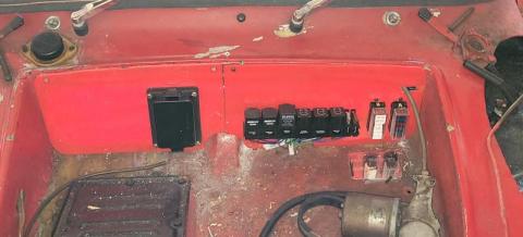 photograph of a new bulkhead with fuse boxes and relays